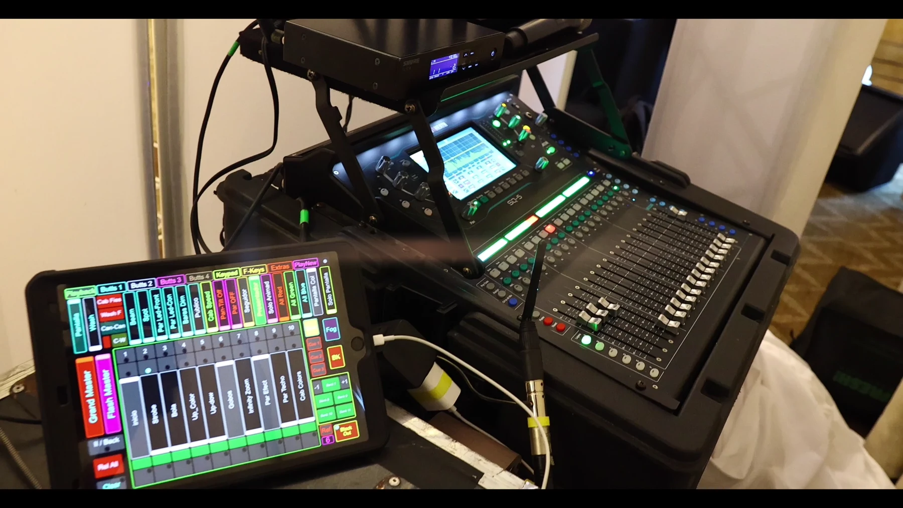 An audio mixing console and tablet at the event production position