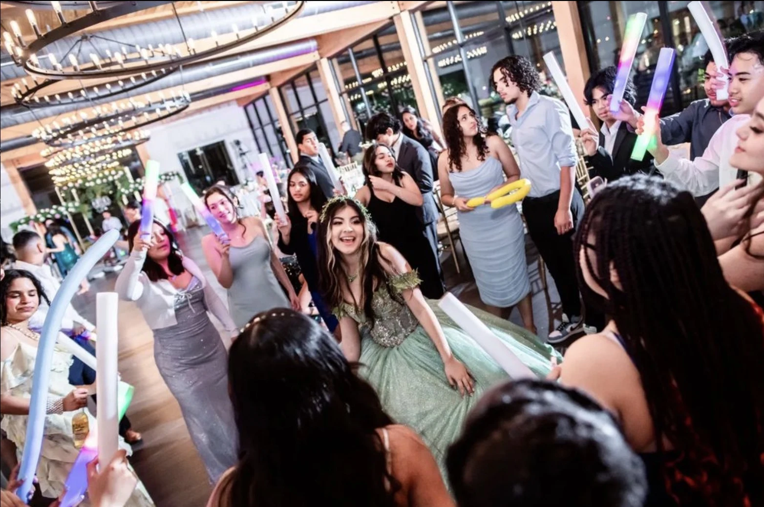 Guests celebrating with glowing party sticks
